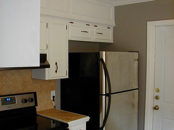 The kitchen has a range/oven, refrigerator, garbage disposal. Plenty of cabinet space.