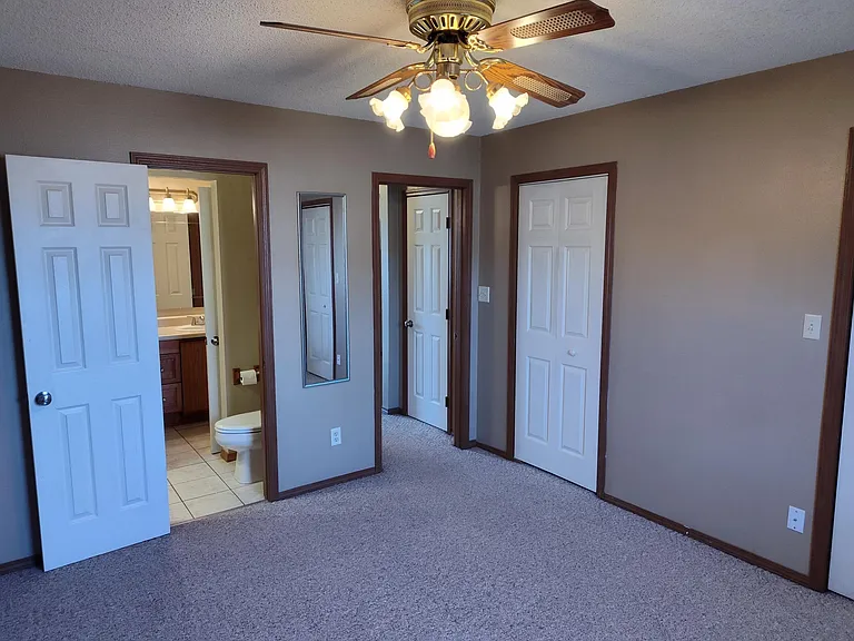 Main bedroom showing bath, two closets.