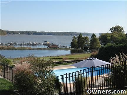 View of pool, pond, and river