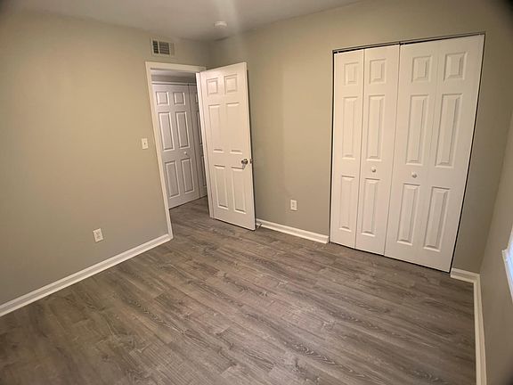 One of four spacious bedrooms...