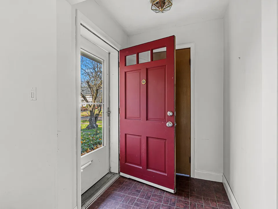 Front entry. Spacious closet behind open door.