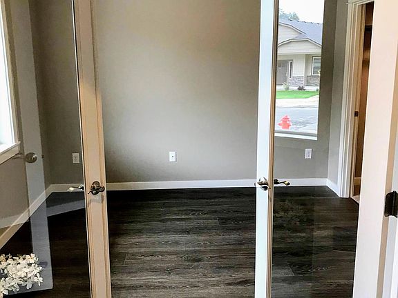 Main floor home office or optional fifth bedroom with large closet.