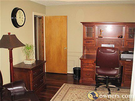 Office with hardwood floors, view of front yard
