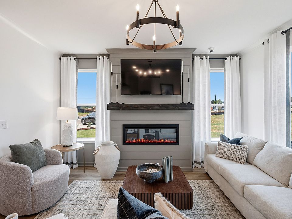 Inviting family room with open concept design and abundant daylight in new construction townhome in