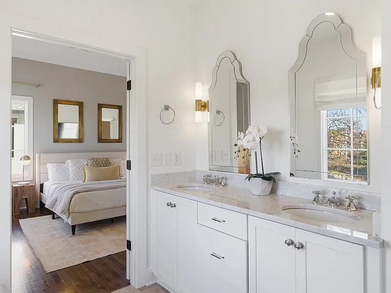 Full Bathroom connected to bedroom 1 with double vanity, shower, and large bathtub.