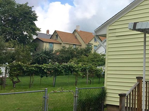 Outside view of side entrance to the house and yard