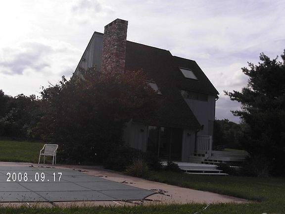 pool adjacent to deck/house