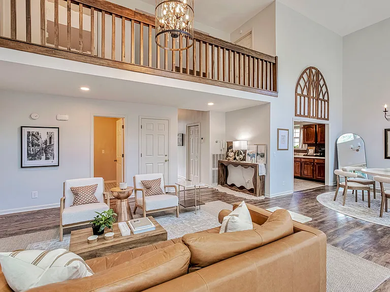 Upstairs hallway has overlook into living room, creating communal vibe
