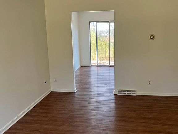 Living room looking front to back towards kitchen/balcony
