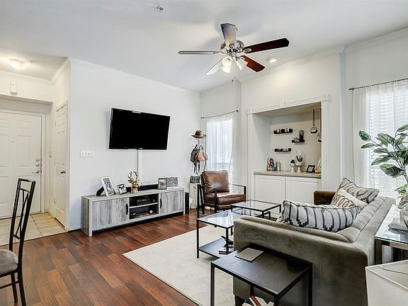 Off the front entry is a coat closet and laundry room