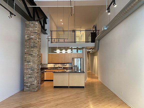 Dining + Kitchen (view of Primary Bedroom above)