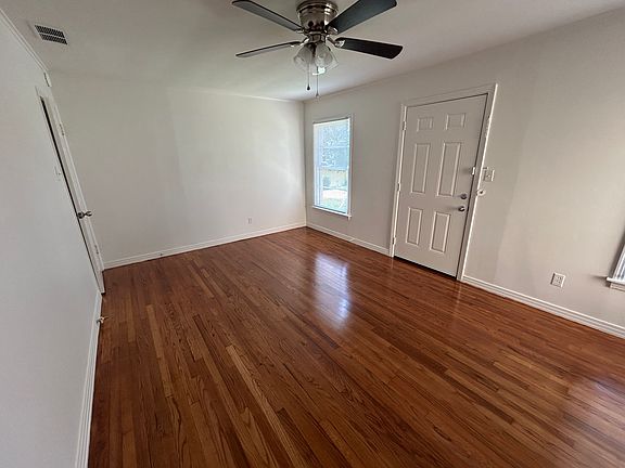 Another angle of living room. Refinished hardwood floors.