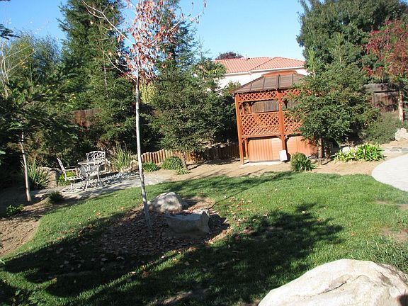 Side yard with spa/gazebo/fountain