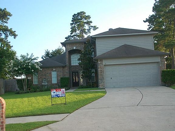 Beautiful landscaping, long driveway, sprinkler system.