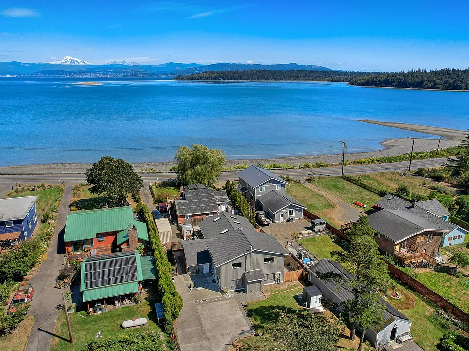 Drone view of the property: beach, bay, mountains
