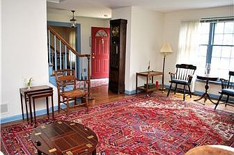 Spacious living rm has fireplace & abundant light