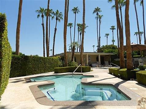The spa is bigger than many pools!  The building in the back houses pool side M/F restrooms, showers & dry saunas.  Also plenty of space to store your 'floaties'.