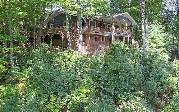 Rear view of residence overlooking Country Club Dr and Golf Course