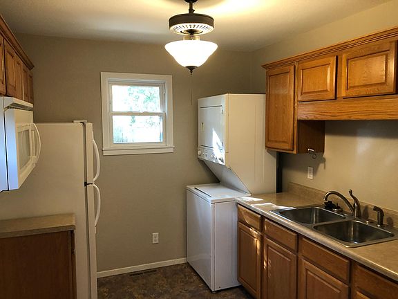 Kitchen with washer/dryer, new electric stove, refrigerator
