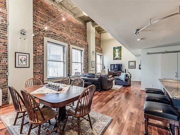 Enjoy dining in this open space with windows providing much loved natural lighting. The brick wall totally pulls the space together for you and your guests.