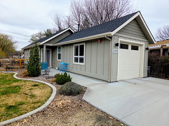 Entry walkway with a small patio.