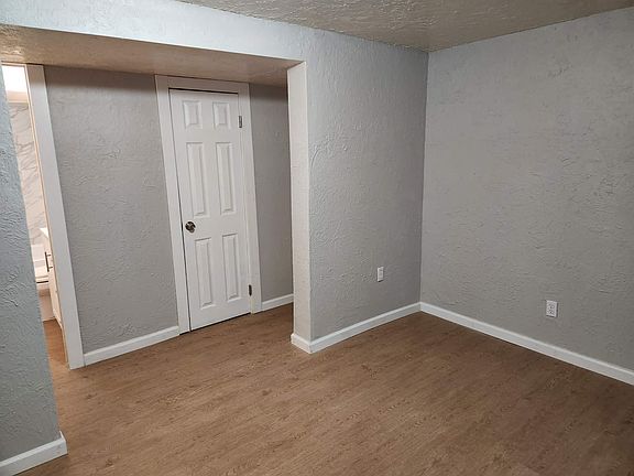 Living Room looking to Hallway and Bathroom