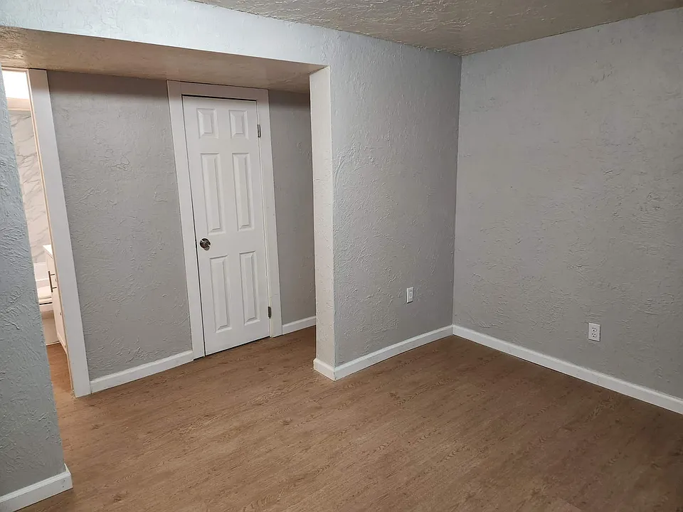Living Room looking to Hallway and Bathroom