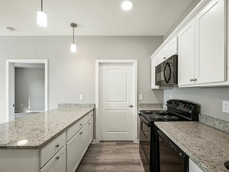 Experience the elegance of this chic, modern kitchen featuring premium finishes.