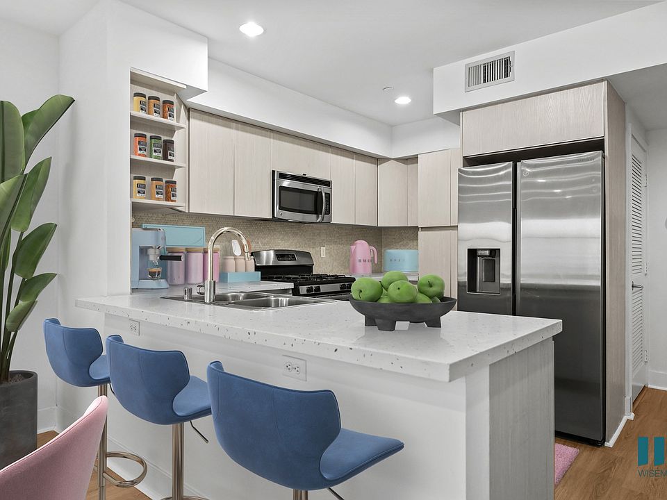Open-Concept Kitchen with Energy-Efficient Appliances and Countertop Bar