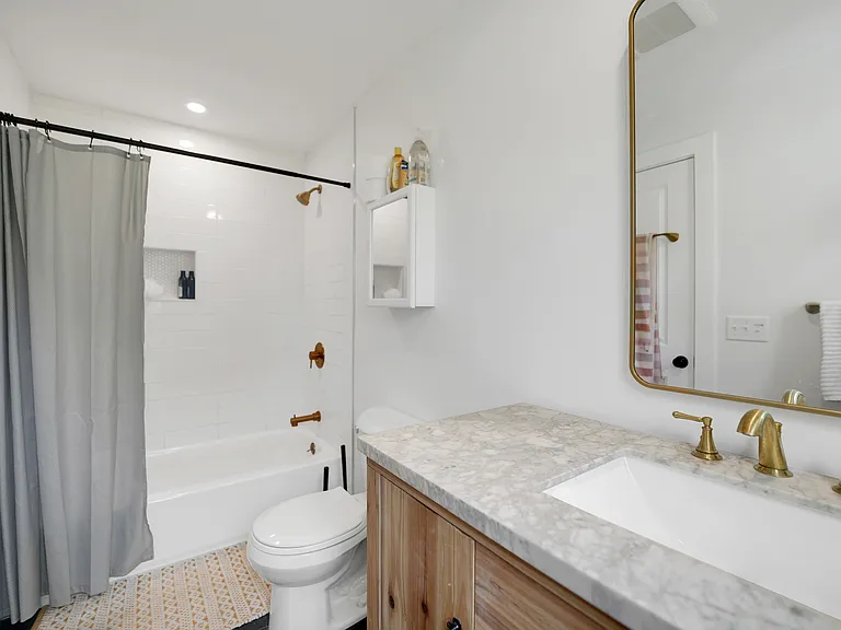 Primary full bathroom on first floor