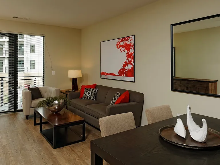 Contemporary dining and living area with hard surface flooring