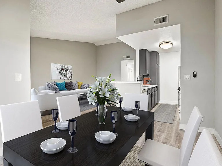 Hardwood floored dining room with view of living room.