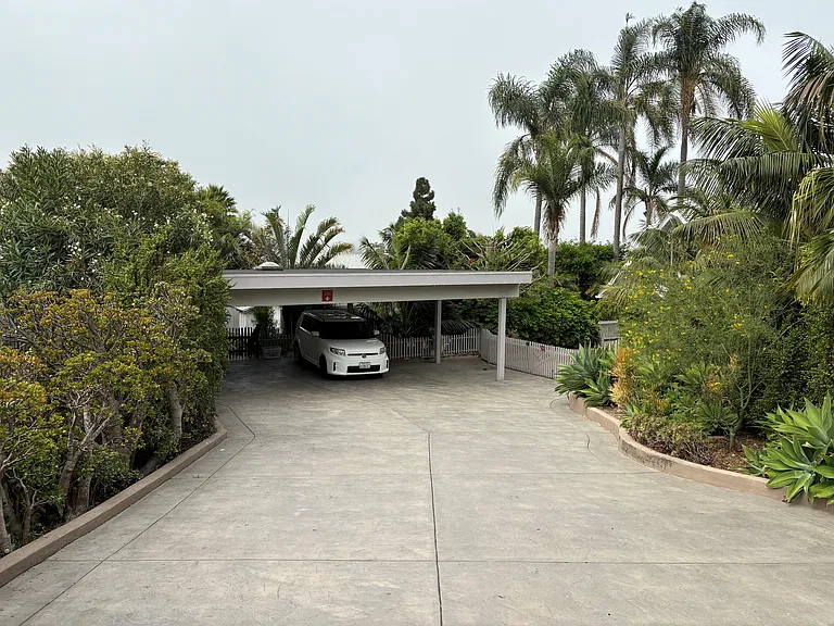 Driveway to carport parking area.