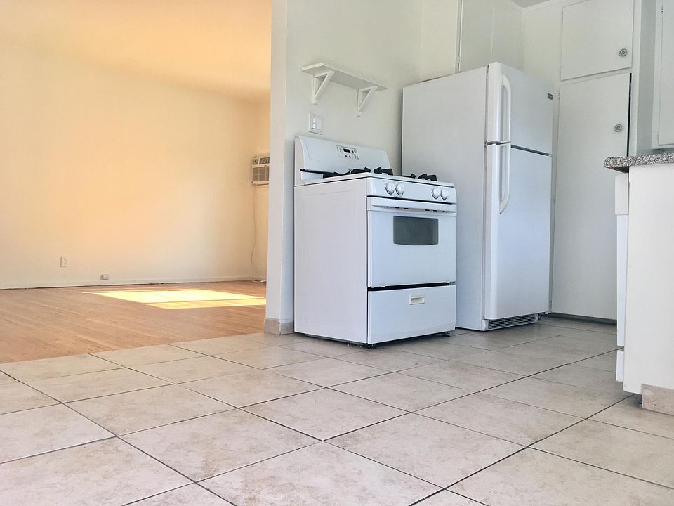 Kitchen and breakfast nook leading to living room