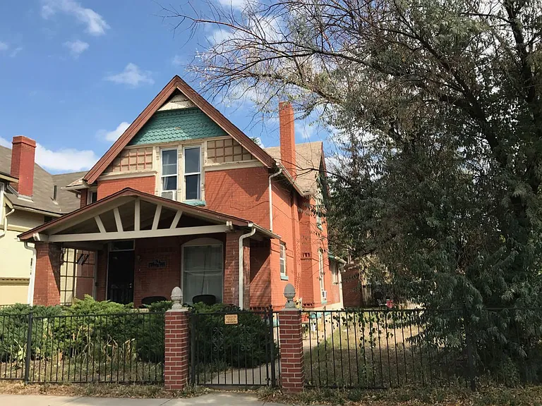 House Exterior, large fenced yard with, vegetable growing box, patio furniture and grill for all tenants to share. Covered front porch with seating.