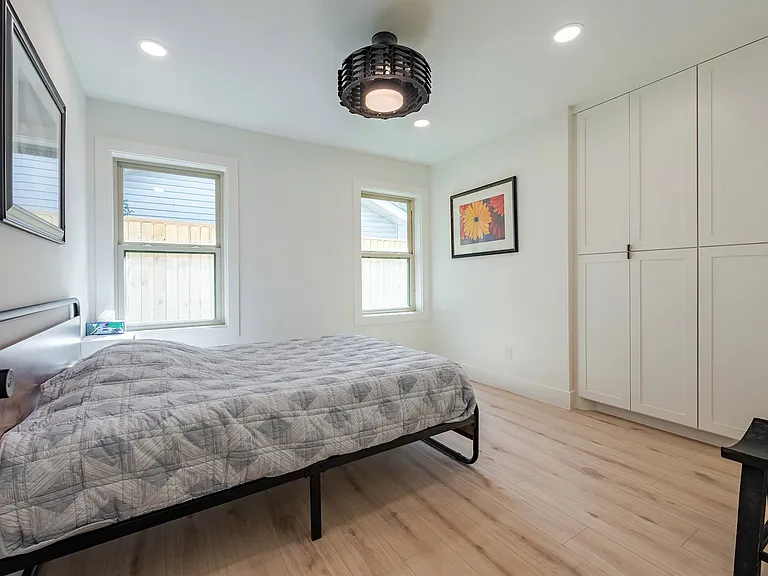 Additional bedroom with versatile use and ample closet space.
