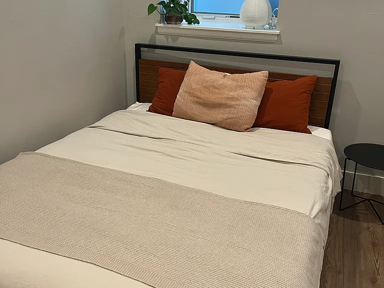 Queen sized bed fits nicely in the bedroom. We can leave the bed and mattress for you or can have it stored away