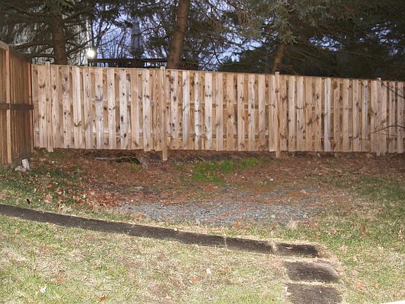 walkway to apartment from backyard gated fence