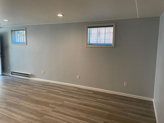 View of living/kitchen from bedroom hallway.