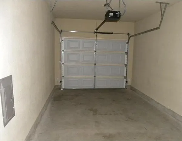 One-car garage with door fab. Garage also has a large storage closet.