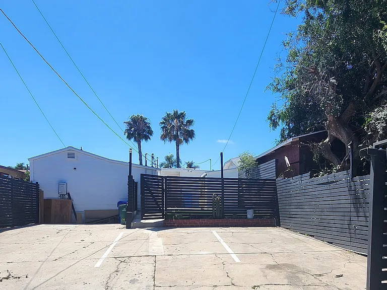Large private secure rear parking with electronic remote gate