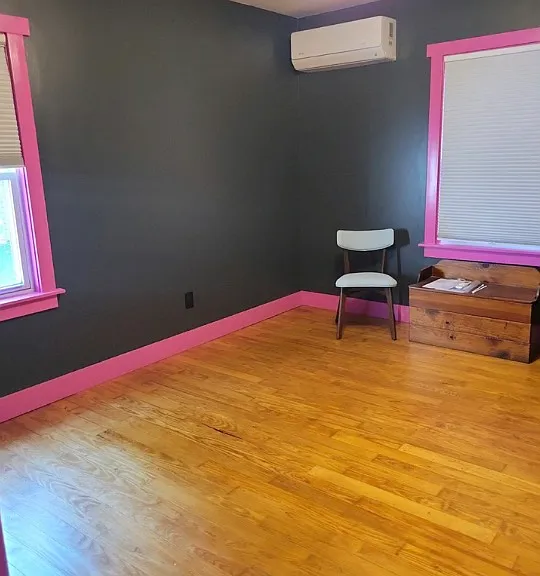 Second bedroom with two north facing windows. Paint colors inspired by the original Penn State University colors.