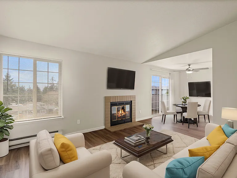 Experience warmth and style in this charming living room with a cozy fireplace and elegant furnishings. Experience warmth and style in this charming living room with a cozy fireplace and elegant furnishings.