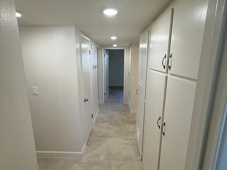 Light & Bright Hallway with lots of cabinets