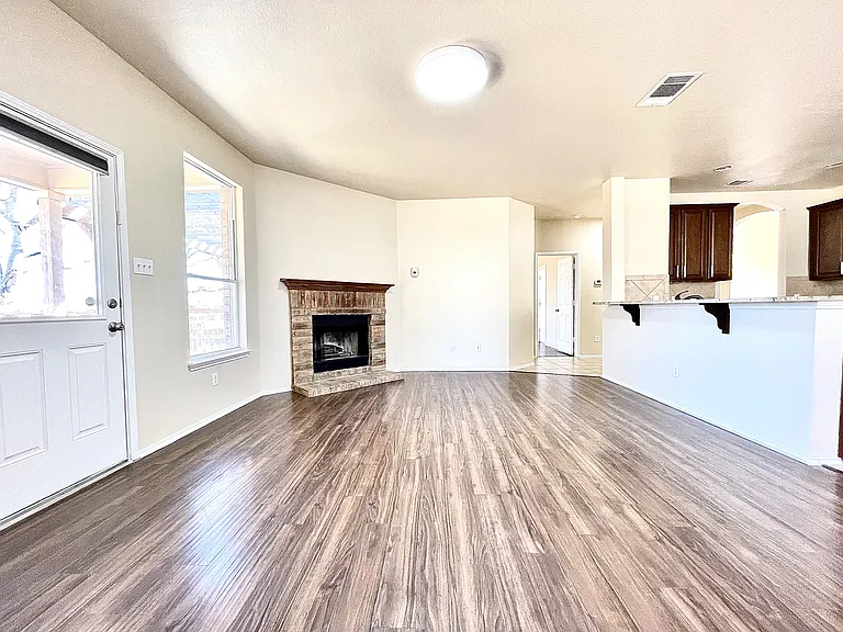 Living room with a great view of the back yard and a fireplace
