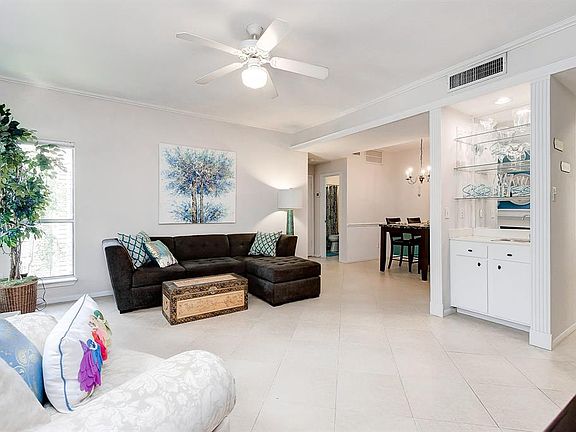 The living room is open to the dining room and kitchen area.
