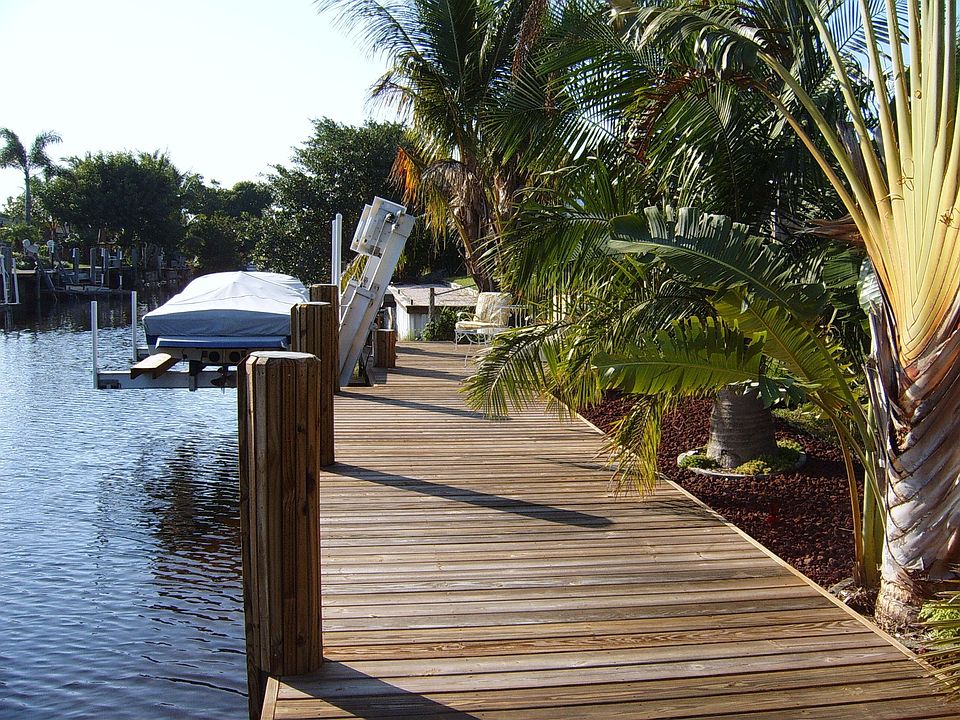 new 70 foot dock and boat lift in backyard