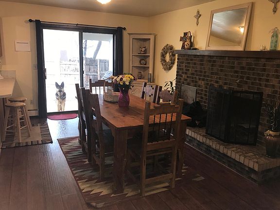 Large dining area off kitchen with fireplace