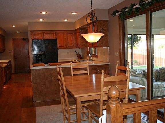 Kitchen with abundant cabinets looking into Sunporch