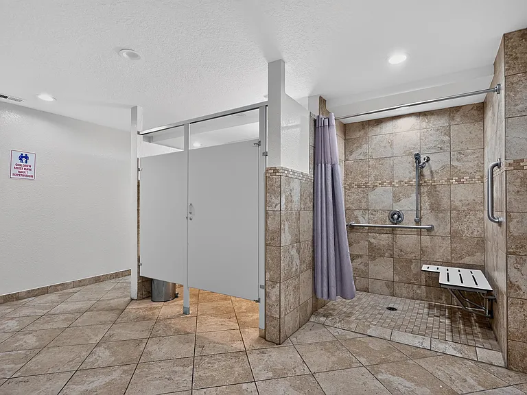 Enjoy a clean, modern bathroom featuring a convenient walk in shower at Renaissance at Carol Stream in Carol Stream, IL.